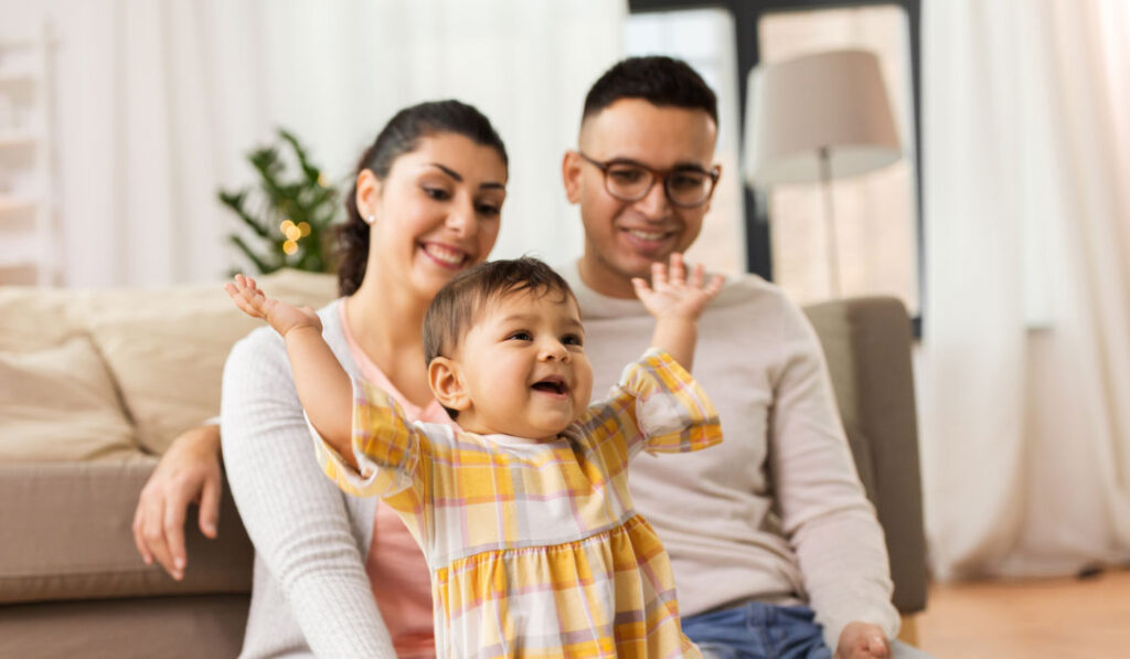 Couple plays with their baby