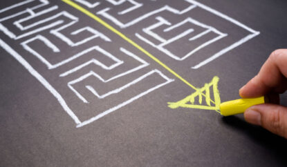 Chalk drawing of maze with clear pathway through