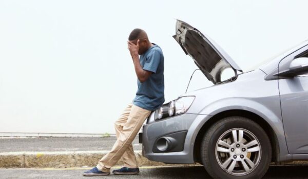 Car broken down with hood up