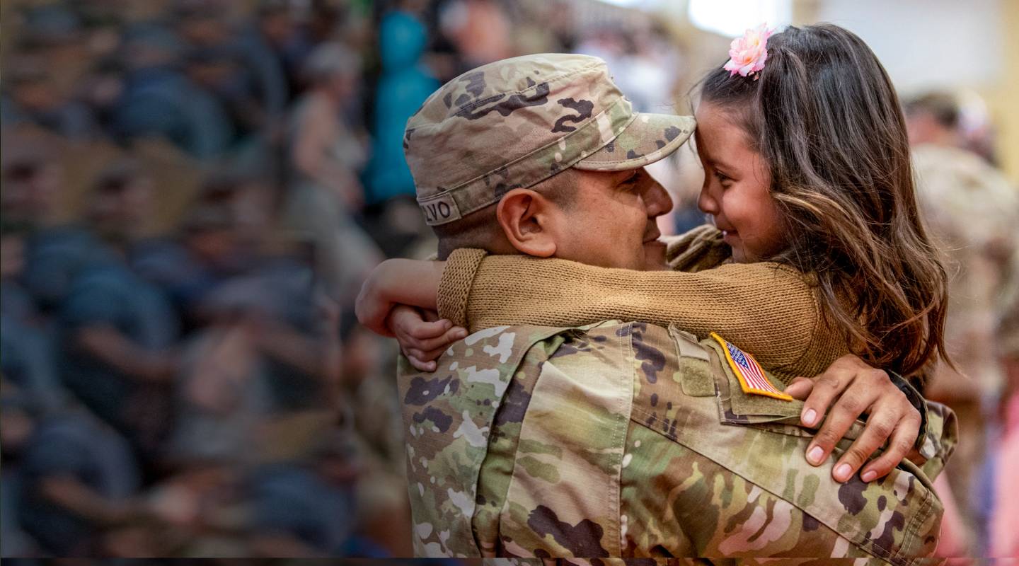 Military father embraces daughter