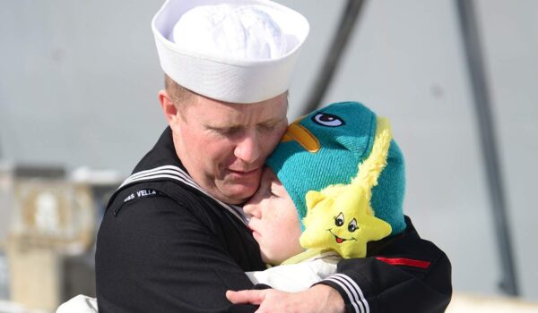 Fire Controlman 2nd Class says goodbye to his daughter before departing