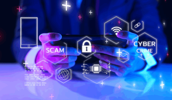 Man holding electronics with copy of scam and cyber crimes overlay