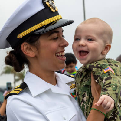 Mother in uniform holding her baby
