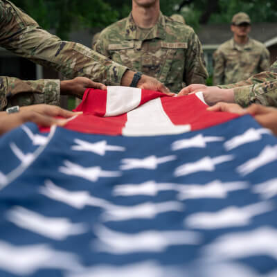 Soldiers folding flag