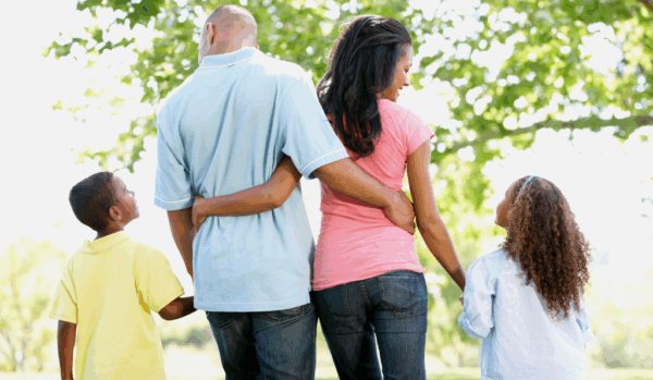 A photo of a family going for a walk.