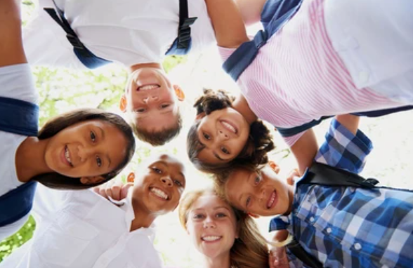 Children huddling together for photo